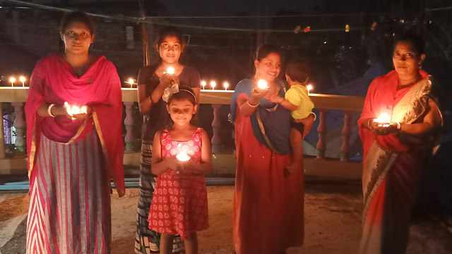 Residents hold candle light to express solidarity and resolute in response to a call of Prime Minister amid coronavirus pandemic across India. Image: Indigenousherald