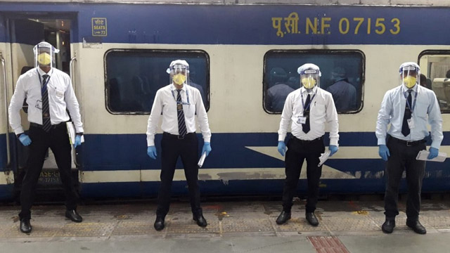 Travelling Ticket Examiners (TTE) wearing protective gears ready to join duty as passenger train services resumed in jurisdiction of Northeast Frontier Railway Monday. Image: PRO, NFR