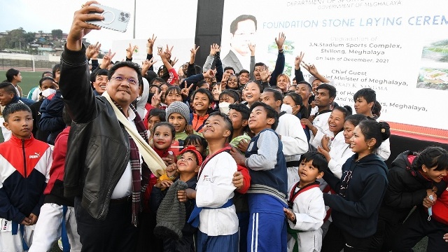 Meghalaya Chief Minister Conrad K Sangma snaps a selfie with children after laying foundation stone for the upgradation of JN Sports Complex at Shillong Tuesday. Image: Indigenousherald 