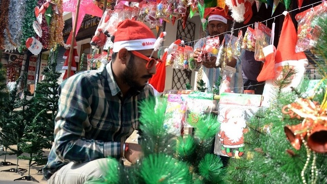 A vendor arranges gift items ahead of Christmas celebration in Agartala Wednesday. Image: Indigenousherald 