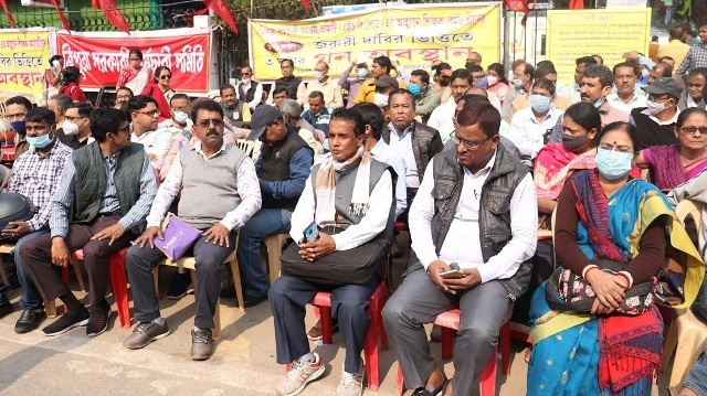 Members of the Tripura Employees Coordination Committee (HGB Road) stage a sit-in demonstration to press demands in Agartala Sunday. Image: Indigenousherald 