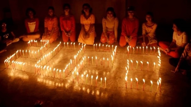 Young girls at a locality in Agartala portray a design with candles Friday midnight to welcome New Year 2022. Image: Indigenousherald