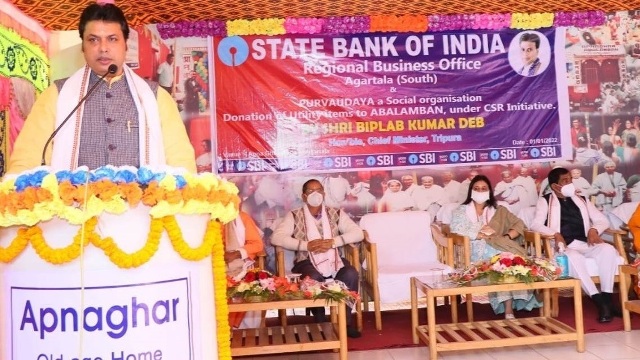 Tripura Chief Minister Biplab Kumar Deb addresses a gathering at an old age home for destitute women in Agartala Saturday after inaugurating a distribution programme sponsored by the State Bank of India. Image: Indigenousherald 