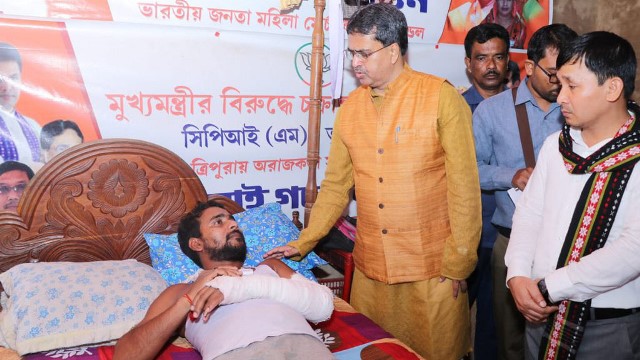Tripura Chief Minister Dr Manik Saha Tuesday visits Gopal Banik who was critically wounded in an attack at Manughat in Dhalai district. Image: Indigenousherald 