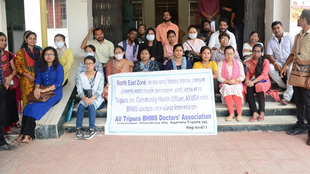 Homeopathic graduates stage protest to demand job in-front of the National Health Mission office in Agartala Friday. Image: Indigenousherald 