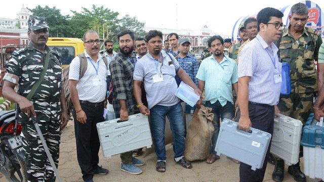 Election staffs after collecting voting materials from a distribution centre in Agartala ready to embark for respecting polling booths Wednesday - a day before assembly by-elections in Tripura. Image: Indigenousherald