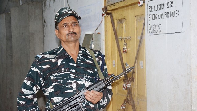 A paramilitary jawan guards an EVM storeroom at a safe house in Agartala Friday a day after elections held in four assembly constituencies in Tripura. Image: Indigenousherald