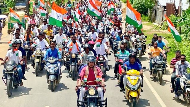 Former Tripura Chief Minister Biplab Kumar Deb rides a bike in a hugely attended motor rally to commemorate Independence Day celebrations at Udaipur in Gomati district Friday. Image: Indigenousherald