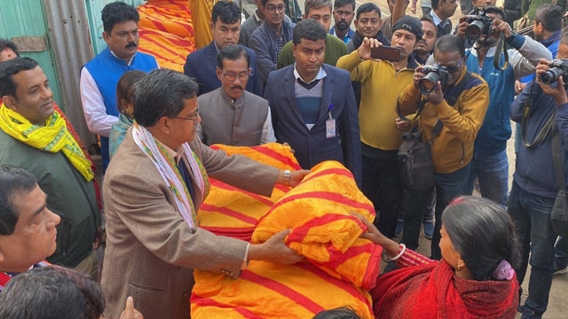 Tripura Chief Minister Dr Manik Saha distributes winter clothes to the destitute people in his Bordowali assembly constituency on the joyful morning of Paush Sankranti in Agartala Sunday. Image: Indigenousherald 