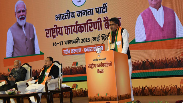 Tripura Chief Minister Dr Manik Saha speaks with Prime Minister Narendra Modi and NJP National President JP Nadda on the podium at the party National Executive Meet at New Delhi Tuesday. Image: CMO