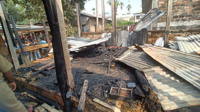 A property of a political supporter razed to ground in an act of vengeance at Dharmanagar suburb in north Tripura Friday. Image: Agency