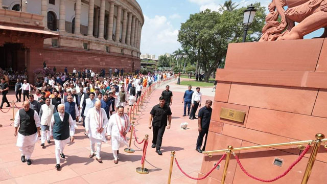 History made: Prime Minister Narendra Modi led Members step out from old parliament building to step into new Parliament Building at New Delhi Tuesday. Image: Web