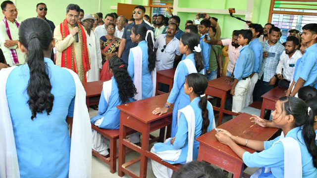 Chief Minister Dr Manik Saha interacts with students at a government school in north Tripura during his official tour in north Tripura Thursday. Image: Web