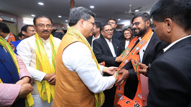 Tripura Chief Minister Dr Manik Saha flanked by state BJP President Rajib Bhattacharjee welcomes 70 lawyers during a joining programme organised by Pradesh BJP Legal Cell in Agartala Thursday. Image: Web