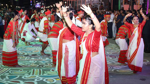 Artists from Indigenous and Bengali communities present a dance to showcase ethnic amity of Tripura during occasion of the “Mayer Gaman” or central immersion procession of Goddess Durga in Agartala Monday. Image: Web