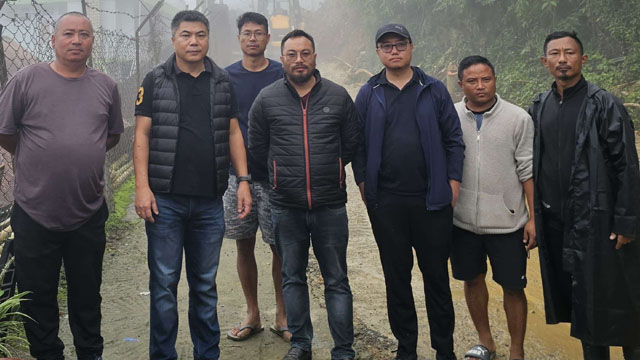 Deputy Commissioner of Kohima B Henok Buchem along with his team undertakes the clearing of landslide debris at Bayavü Colony Sunday. Image: DIPR