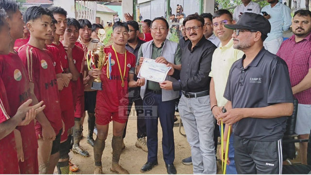 DC, Meluri, K Mhathung Tsanglao with the NHIDCL officials presenting trophy to the winning team during the Youth Football Match held at Meluri in Nagaland Monday. Image: DIPR
