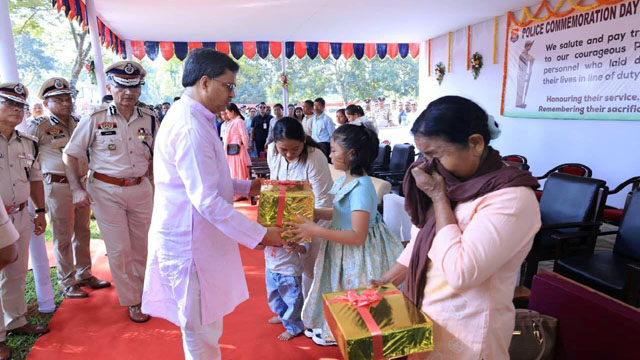 Tripura Chief Minister Dr Manik Saha meets family of a martyred policeman during observance of police commemoration day in Agartala Tuesday. Image: DICA